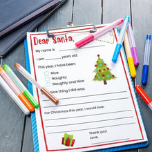 Load image into Gallery viewer, Dear Santa letter with prompts on blue clipboard with colored markers on wood background