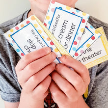 Load image into Gallery viewer, boy holding reading reward coupons