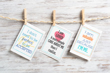 Load image into Gallery viewer, positive affirmation cards in fun colors and designs hanging on clothespins on wood background