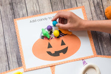 Load image into Gallery viewer, child playing with play doh halloween jack o lantern printable mat

