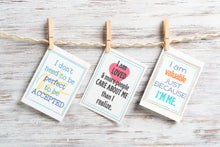 Load image into Gallery viewer, positive affirmation cards in fun colors and designs hanging on clothespins on wood background
